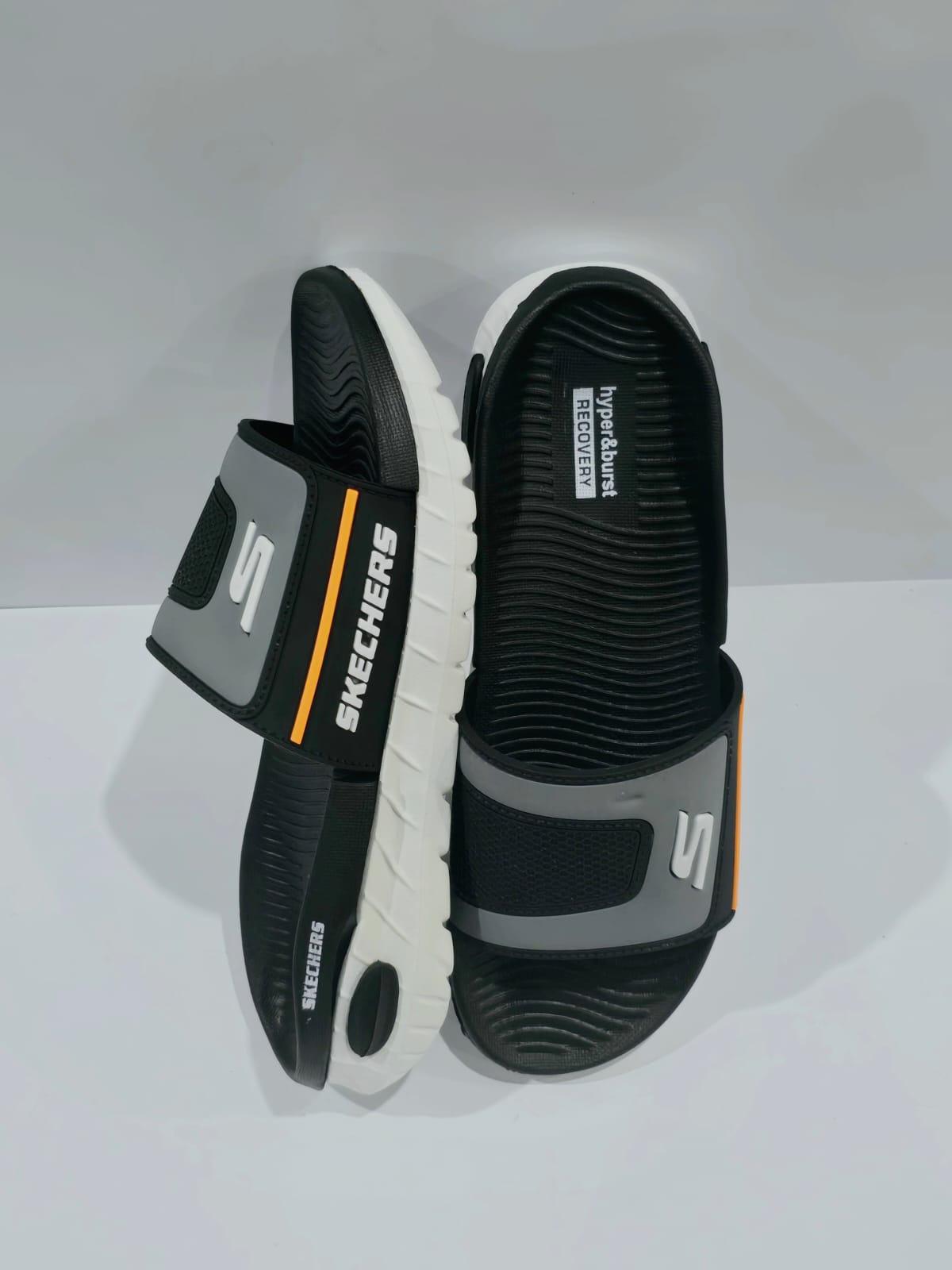 SkechStep HyperBurst Slides – Black/Grey with Orange Detail (Comfort Edition)
